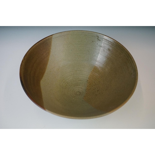 70 - A Studio pottery bowl of St Ives influence, with impressed maker's mark, 26cm diameter