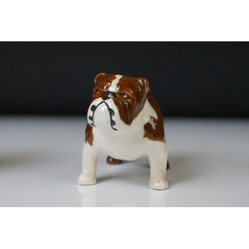 71 - Six Beswick porcelain dog figures to include a Bosun Bulldog (1731), Labrador (1956), Dachshund Begg... 