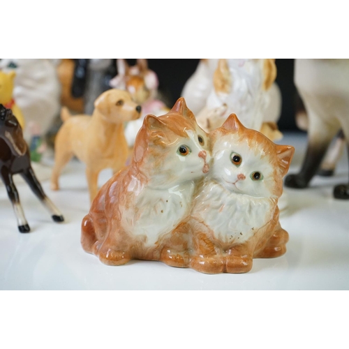 79 - 11 Beswick porcelain animal figures to include a brown matt horse, Siamese cat (with paper label), s... 