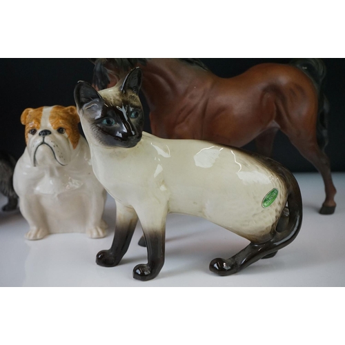 79 - 11 Beswick porcelain animal figures to include a brown matt horse, Siamese cat (with paper label), s... 