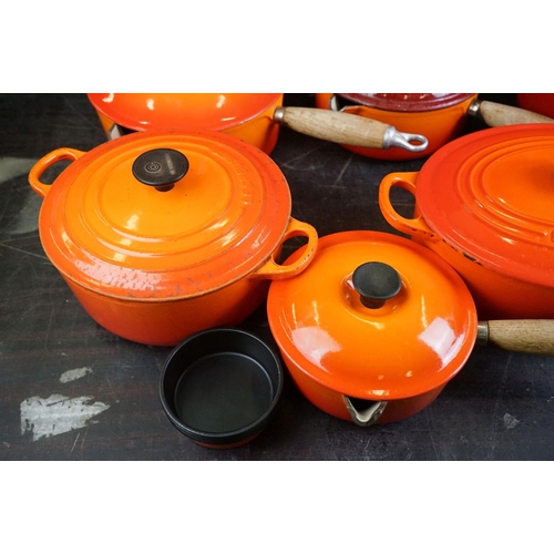 101A - Le Creuset Orange Cast Iron and Enamel Ovenware, 8 items, to include a frying pan, 5 lidded saucepan... 