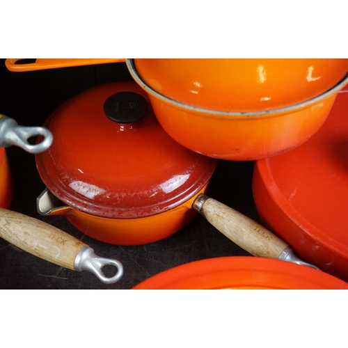 101A - Le Creuset Orange Cast Iron and Enamel Ovenware, 8 items, to include a frying pan, 5 lidded saucepan... 