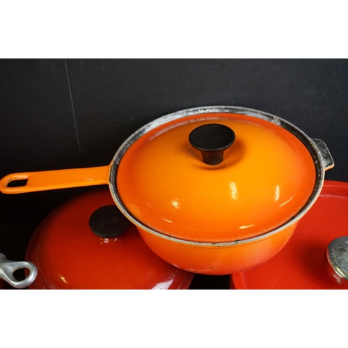 101A - Le Creuset Orange Cast Iron and Enamel Ovenware, 8 items, to include a frying pan, 5 lidded saucepan... 