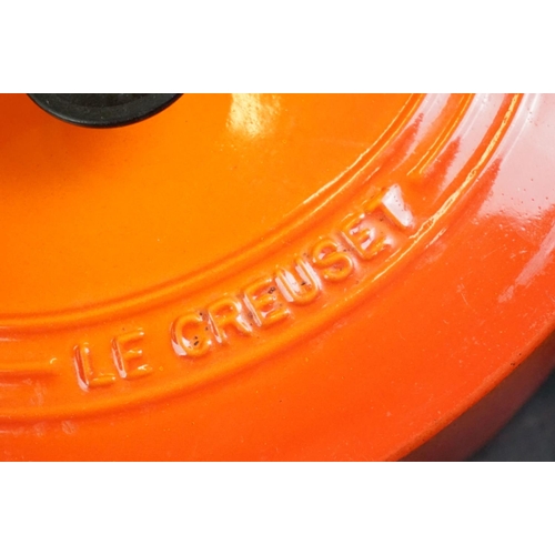 101A - Le Creuset Orange Cast Iron and Enamel Ovenware, 8 items, to include a frying pan, 5 lidded saucepan... 