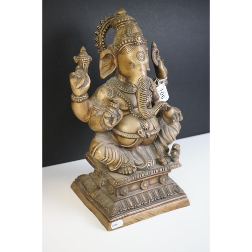 106 - Heavy Cast Brass Indian figure of Hindu Deity Ganesh, sat on a raised square plinth, holding objects... 