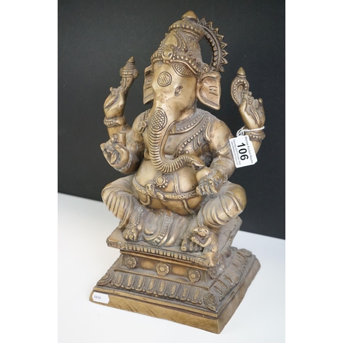 106 - Heavy Cast Brass Indian figure of Hindu Deity Ganesh, sat on a raised square plinth, holding objects... 