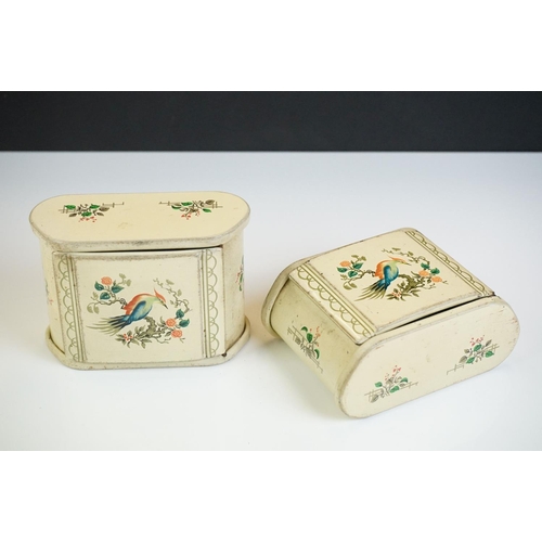 112 - A pair of Art Deco toleware cigarette boxes, each with hinged lid decorated with exotic birds, on a ... 