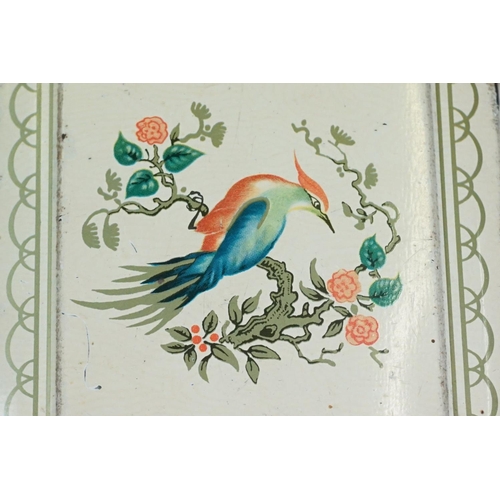 112 - A pair of Art Deco toleware cigarette boxes, each with hinged lid decorated with exotic birds, on a ... 