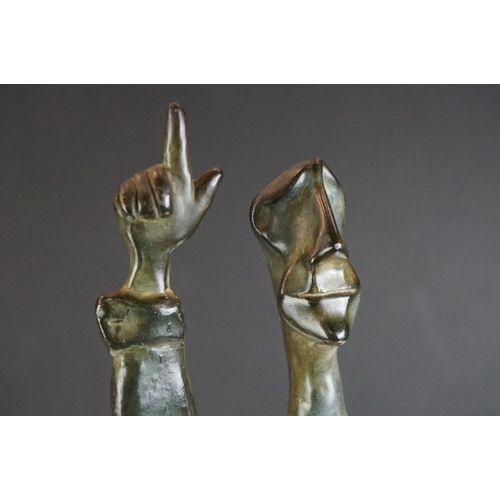 116 - Israeli bronzed metal sculpture of a stylised figure balancing on one hand, signed and dated 1989, 2... 