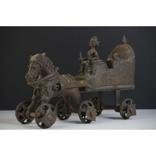 123 - Indian Cast Metal Horse and Carriage sculpture with a Hindu figure riding on the carriage and moveab... 