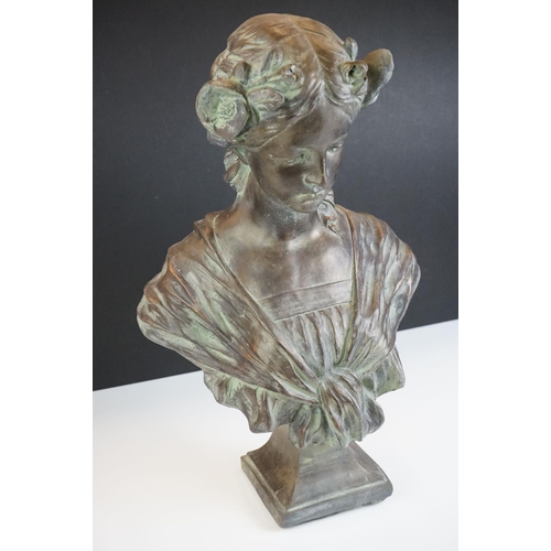 126 - A terracotta bust of a lady of classical form in robed dress, with mock Verdigris finish, raised on ... 