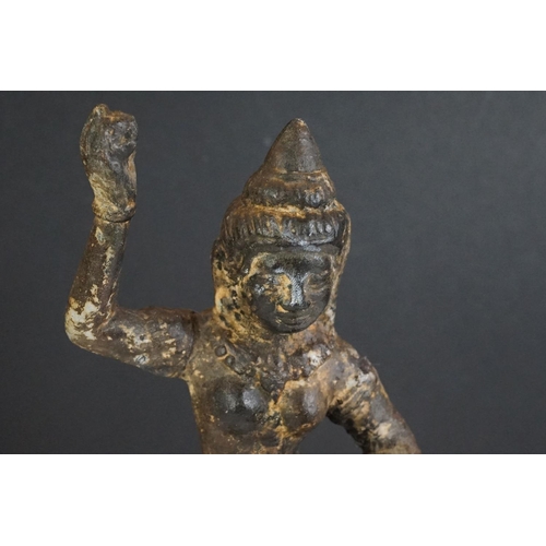 127 - Cast Iron Indian model of a dancing Hindu figure, on a circular base, 31cm high