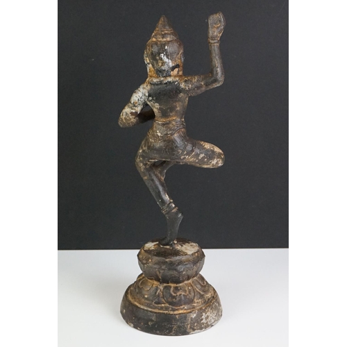 127 - Cast Iron Indian model of a dancing Hindu figure, on a circular base, 31cm high