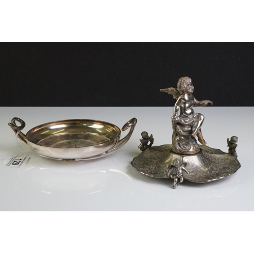 129 - A Victorian silver plated table centrepiece with a winged cherub holding a butterfly above three sha... 