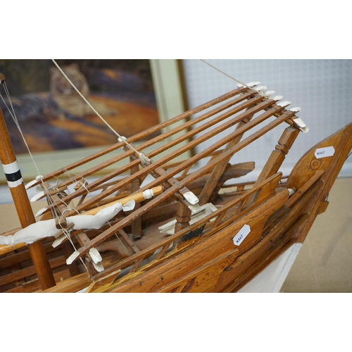 131 - Scratch-built painted wooden model of a sailing ship, with two masts, sails and rigging details, app... 