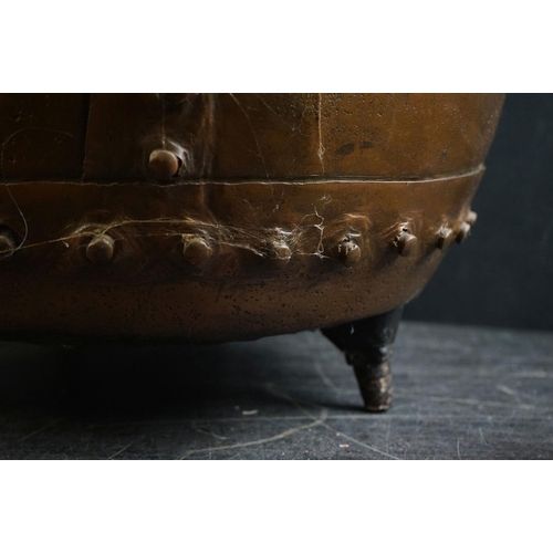 150 - Antique copper studded coal bucket / planter, raised on three feet, 51cm diameter x 37cm high