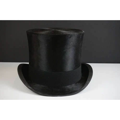 152 - A Henry Heath black silk top hat, size 7.5 ins, in the original fitted box with owner's name and dat... 