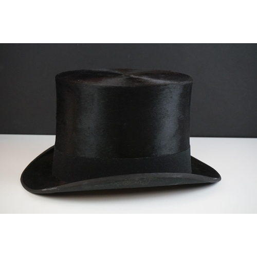 152 - A Henry Heath black silk top hat, size 7.5 ins, in the original fitted box with owner's name and dat... 