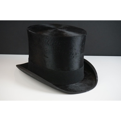 152 - A Henry Heath black silk top hat, size 7.5 ins, in the original fitted box with owner's name and dat... 