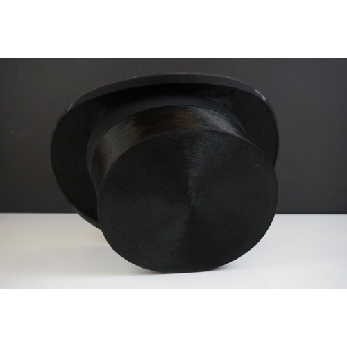 152 - A Henry Heath black silk top hat, size 7.5 ins, in the original fitted box with owner's name and dat... 