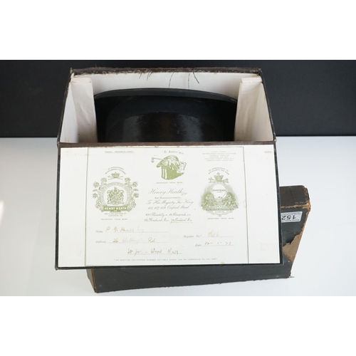 152 - A Henry Heath black silk top hat, size 7.5 ins, in the original fitted box with owner's name and dat... 