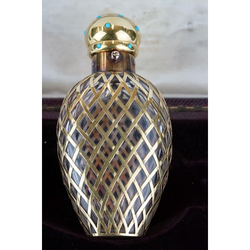 201 - Hancock & Co scent bottle, the tapered glass body with yellow metal fretwork overlay, the yellow met... 