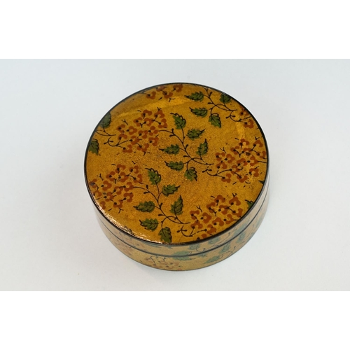 205 - Lacquered circular trinket box, hand painted floral and foliate decoration, diameter approx 8.5cm

P... 