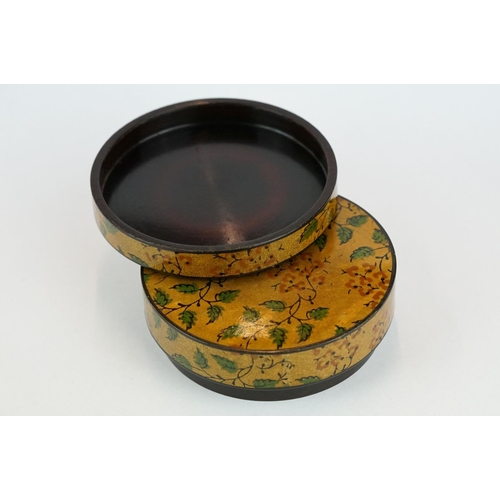 205 - Lacquered circular trinket box, hand painted floral and foliate decoration, diameter approx 8.5cm

P... 