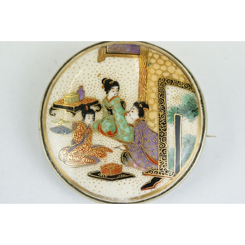 214 - Satsuma circular brooch, hand painted ceramic panel depicting Geisha women, rubover set, white metal... 