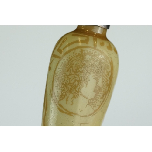 225 - 19th century scent bottle, the tapered glass body depicting faces in profile and the words Xapie, th... 