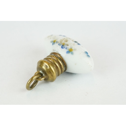 230 - Miniature white porcelain torpedo shaped scent bottle with hand painted forget-me-nots, brass screw ... 