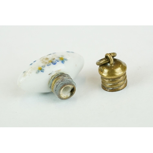 230 - Miniature white porcelain torpedo shaped scent bottle with hand painted forget-me-nots, brass screw ... 