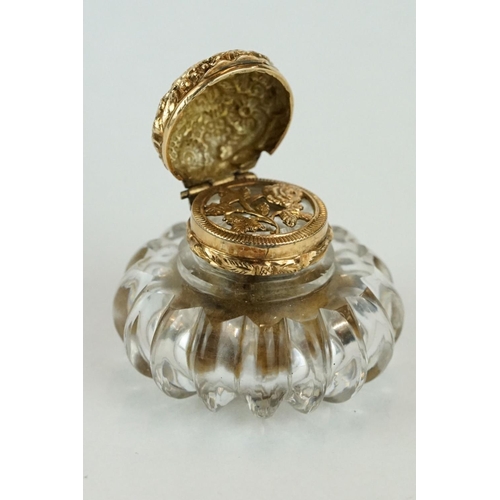 236 - Vinaigrette of bottle form, squat glass body, yellow metal collar and hinged lid, repousse rose and ... 