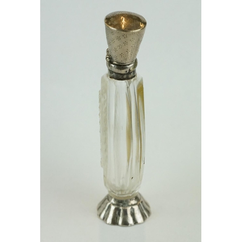 241 - 18th century scent bottle, oval faceted glass bottle with  silver mounts, engraved floral and scroll... 