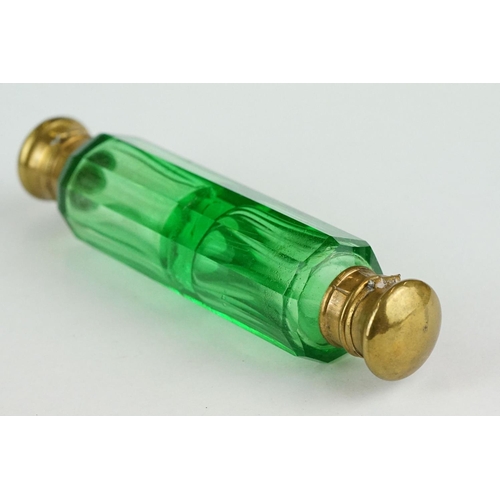 243 - 19th century green glass double ended gilt scent bottle, each end containing original stopper, lengt... 