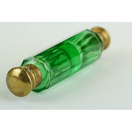 243 - 19th century green glass double ended gilt scent bottle, each end containing original stopper, lengt... 