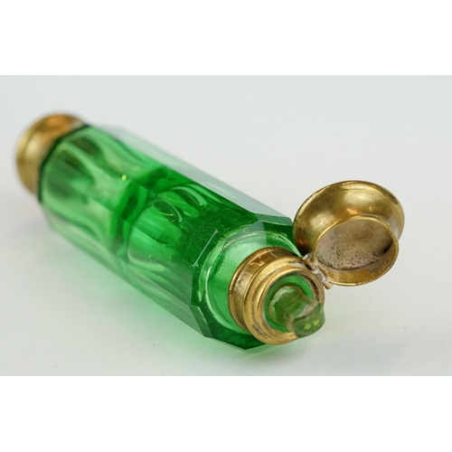 243 - 19th century green glass double ended gilt scent bottle, each end containing original stopper, lengt... 