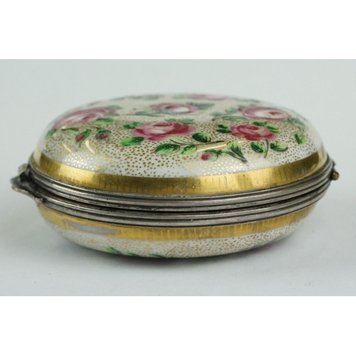 256 - Continental ceramic and white metal circular trinket box with hand-painted roses to the outside and ... 