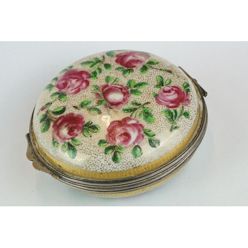 256 - Continental ceramic and white metal circular trinket box with hand-painted roses to the outside and ... 