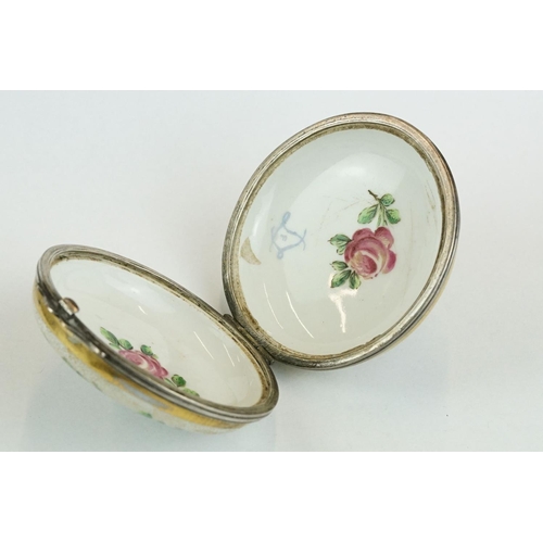 256 - Continental ceramic and white metal circular trinket box with hand-painted roses to the outside and ... 