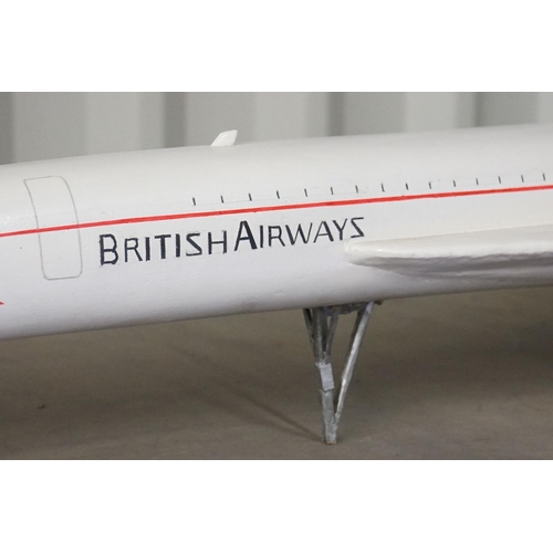 88 - British Airways Concorde - large scratch built painted wooden model, resting on its wheels, approx 1... 