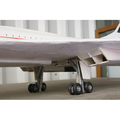 88 - British Airways Concorde - large scratch built painted wooden model, resting on its wheels, approx 1... 