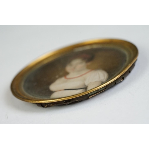 156 - 19th century English School, portrait miniature of a young woman wearing a coral headband and neckla... 