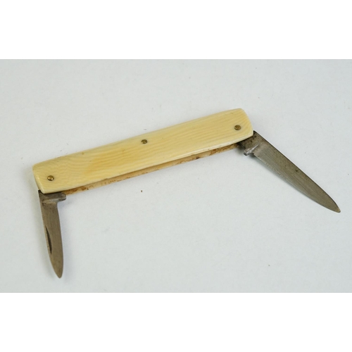 157 - A fine quality Continental twin bladed pen knife stamped INOX, Solingen, the brass sides embossed wi... 