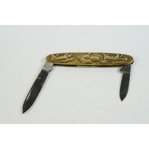 157 - A fine quality Continental twin bladed pen knife stamped INOX, Solingen, the brass sides embossed wi... 