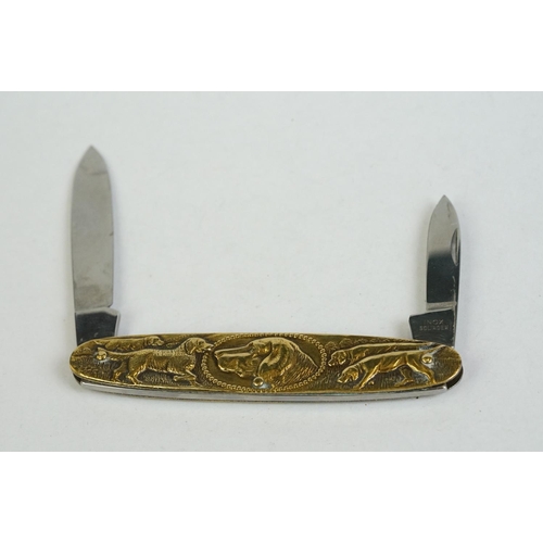 157 - A fine quality Continental twin bladed pen knife stamped INOX, Solingen, the brass sides embossed wi... 