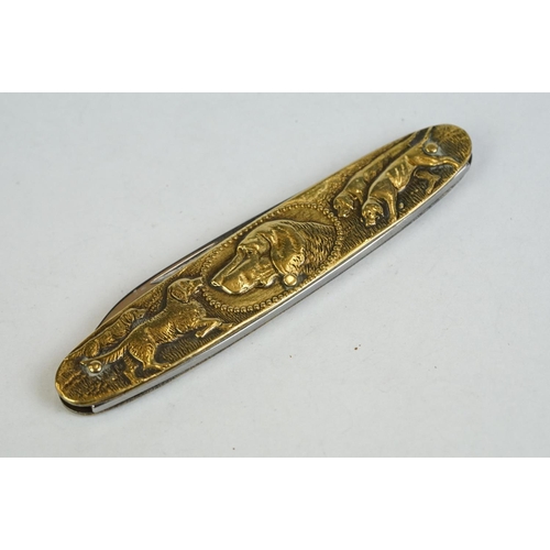 157 - A fine quality Continental twin bladed pen knife stamped INOX, Solingen, the brass sides embossed wi... 