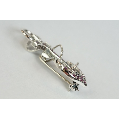 167 - A silver and ruby set anchor style brooch-pendant necklace