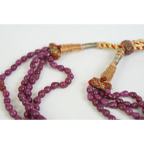 184 - A ladies four row strung beaded stone necklace.