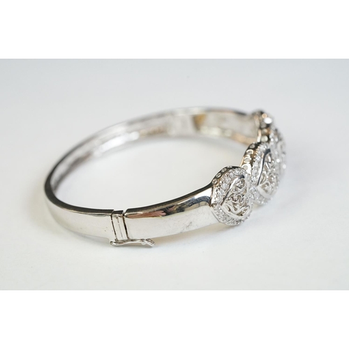 187 - A silver and CZ heart set bangle